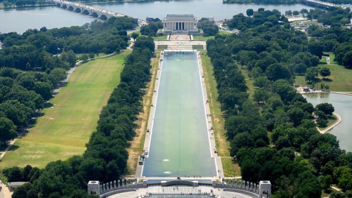 interior-department-adds-fencing-around-reflecting-pool-amid-reports-of-vandalism